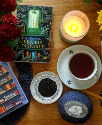 autumn books, candle, chrysanthemums and knitting with a cup of tea, ambiance shot