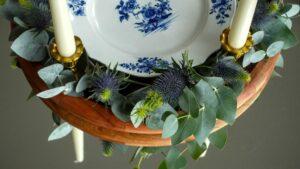 An elegant vintage Belgian Tournai porcelain plate arranged on a table for a slow reading ritual.