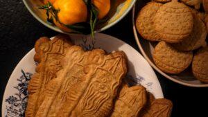 A plate of authentic Belgian speculoos cookies, showing the traditional golden-brown crunch.