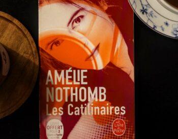Portrait of the Belgian writer Amélie Nothomb, famous for her unique hats and prolific writing.