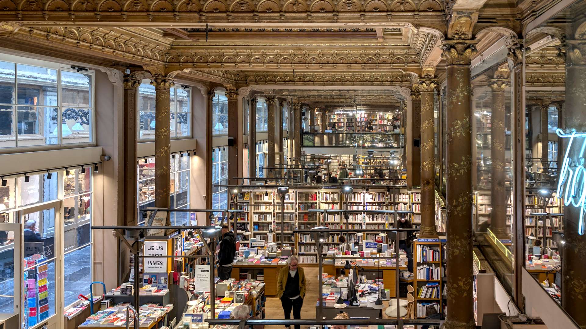 The stunning mirrored interior of Tropismes bookshop in Brussels, once a 19th-century ballroom.