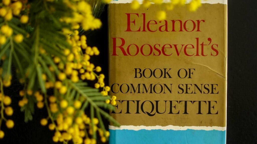 Flatlay of "The Book of Common Sense Etiquette" by Eleanor Roosevelt, exploring the intersection of character and manners.