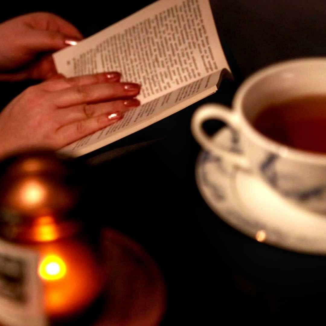 Portrait of the Belgian writer Amélie Nothomb, famous for her unique hats and prolific writing.